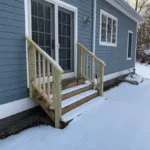 Exterior wooden stair installation angled perspective showing pressure-treated wood.