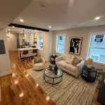 Multifamily Renovation Project showcasing open living space with hardwood floors and updated finishes