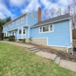Exterior house painting in New Fairfield completed front facade in light blue