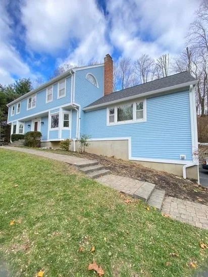 Exterior house painting in New Fairfield completed front facade in light blue