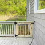 A newly installed wood gate as part of a deck structural repair project.